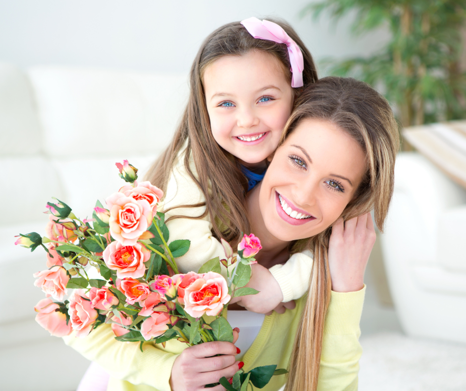 Daughter gifting flowers to mom on Mother's Day